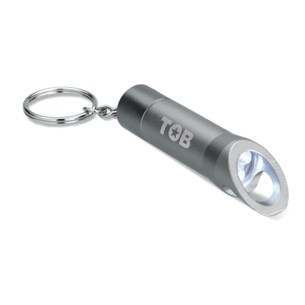A keyring that features a metal LED flashlight and a bottle opener, brought to you by Little Snoring. - Kingsclere