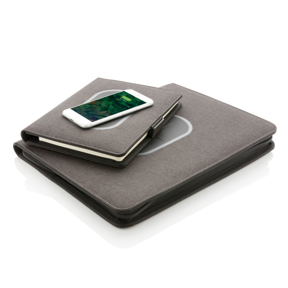 A portfolio that comes with a power bank and a notepad, which also doubles up as a wireless charging pad. - Berkswell