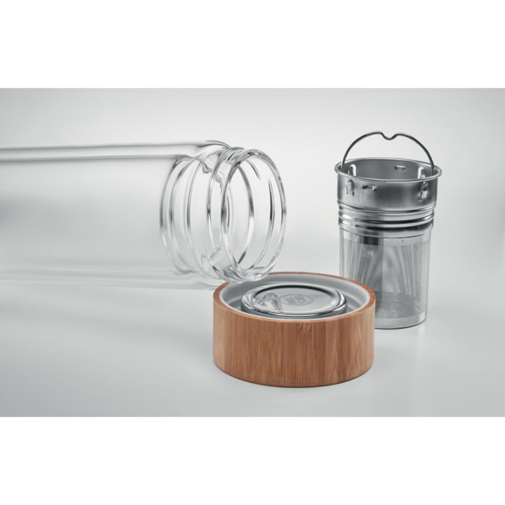 A glass bottle with a bamboo lid and a tea infuser - Tettenhall
