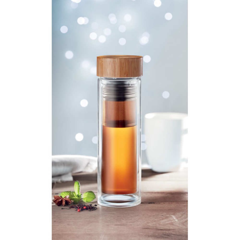 A glass bottle with a bamboo lid and a tea infuser - Tettenhall