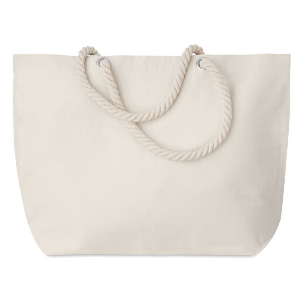 A cotton bag with a cord handle that can be used for the beach or for shopping - Saltwood