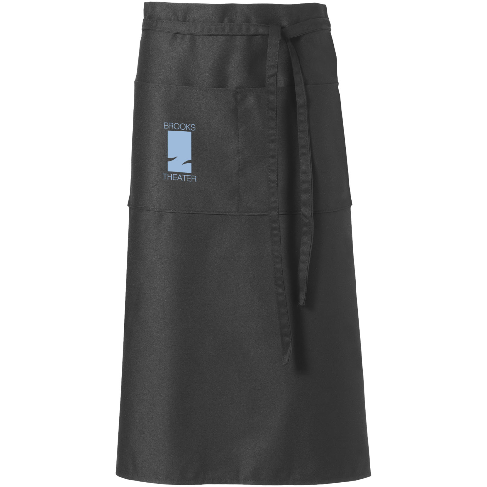 This is an apron made from twill fabric. It has pockets for convenience and also features a tie back closure for easy fitting. - Ince-in-Makerfield