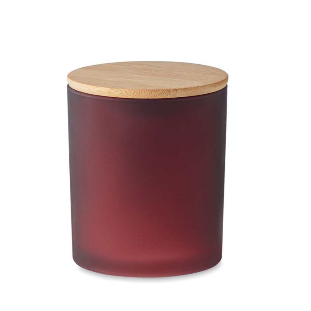 This is a fragranced candle made from plant-based wax. It comes in a frosted glass jar with a bamboo lid. - Holdenhurst