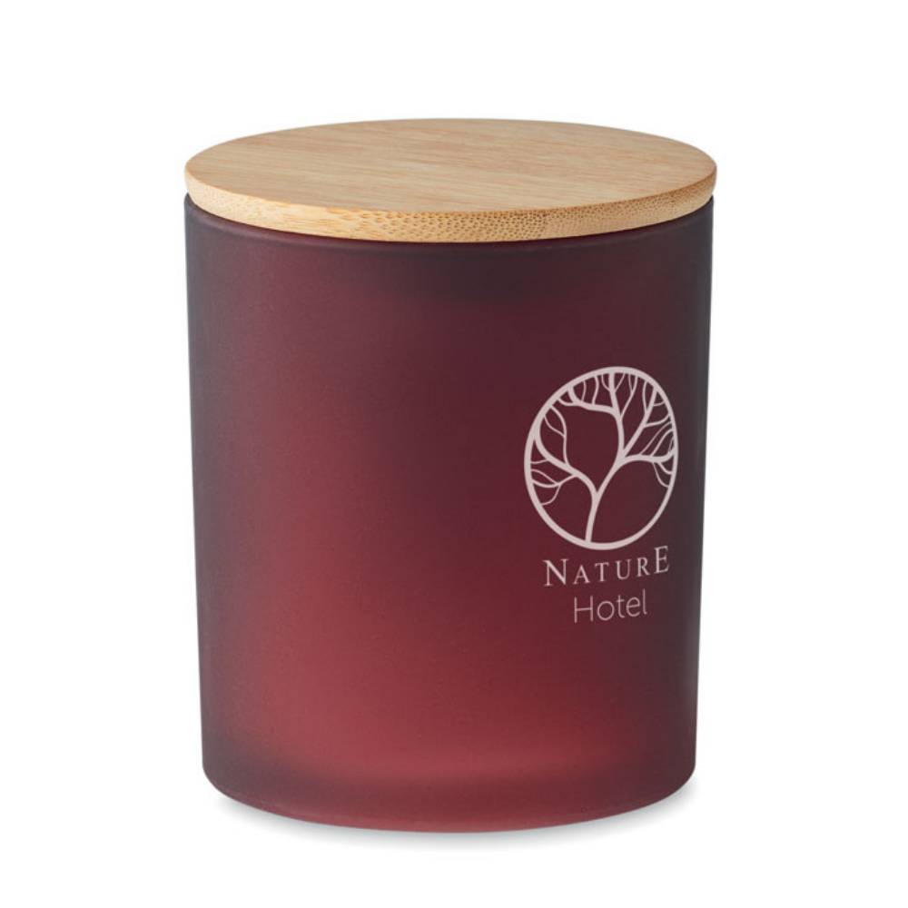 A scented candle made from plant-based wax that comes in a glass jar, complete with a bamboo lid - Liss