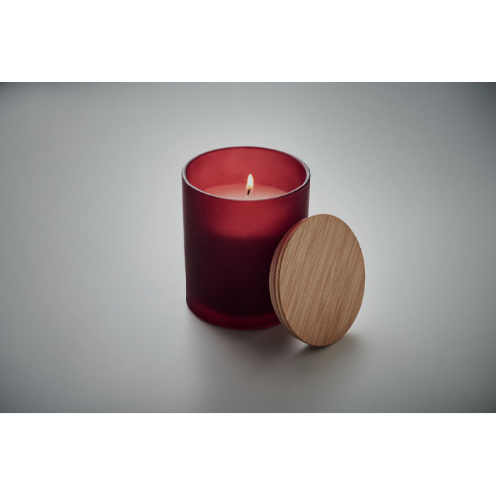 A scented candle made from plant-based wax that comes in a glass jar, complete with a bamboo lid - Liss