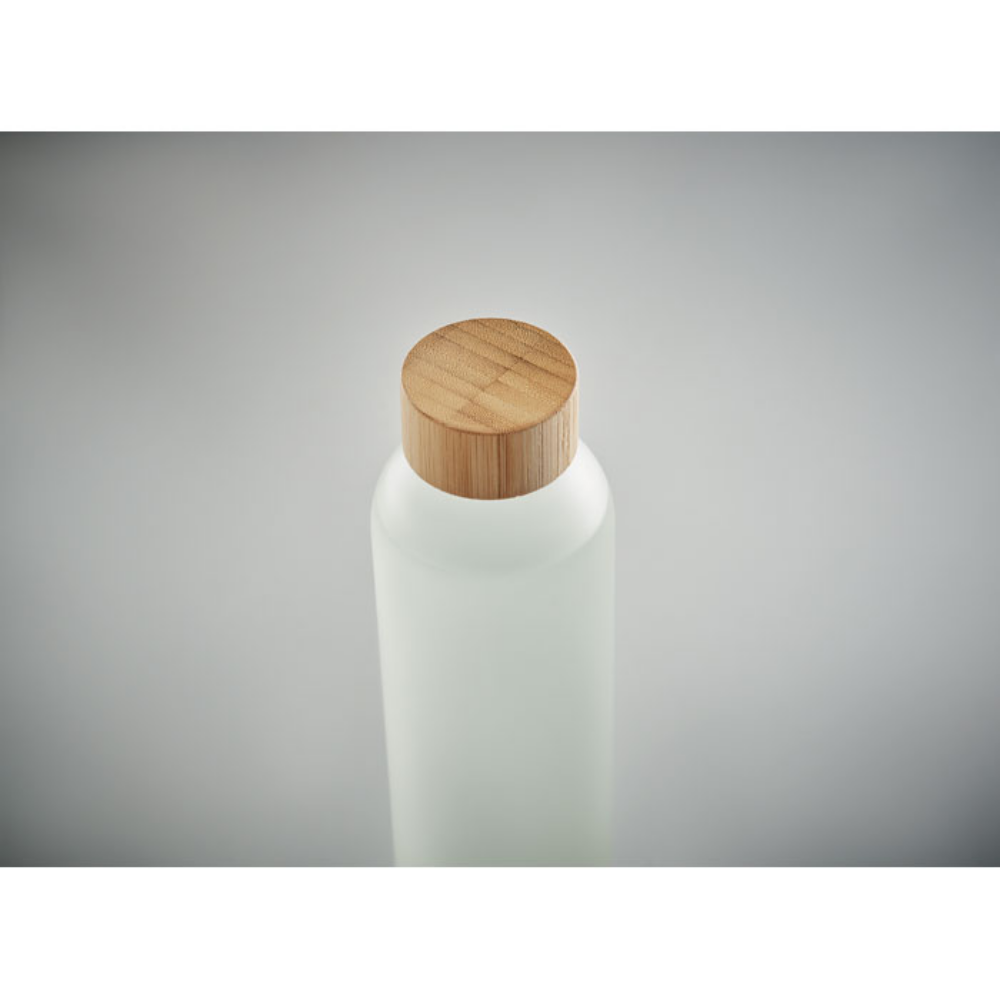 A glass bottle with a bamboo lid that has undergone the process of sublimation, from Ogbourne Saint Andrew - Haydock
