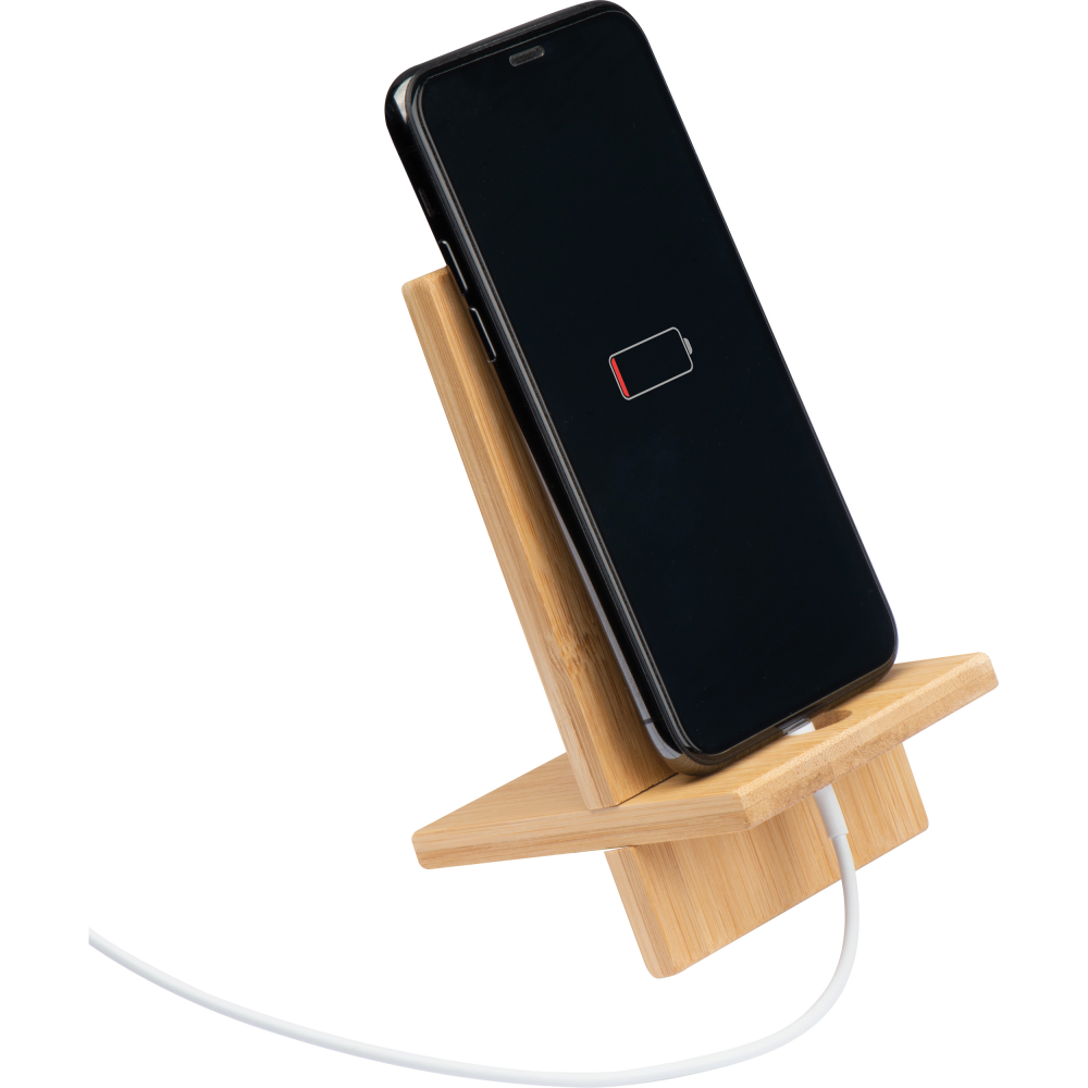 This is a charging station that can be placed on a desk or similar surface. It's made from bamboo and originates from Ashbocking. - Lewes
