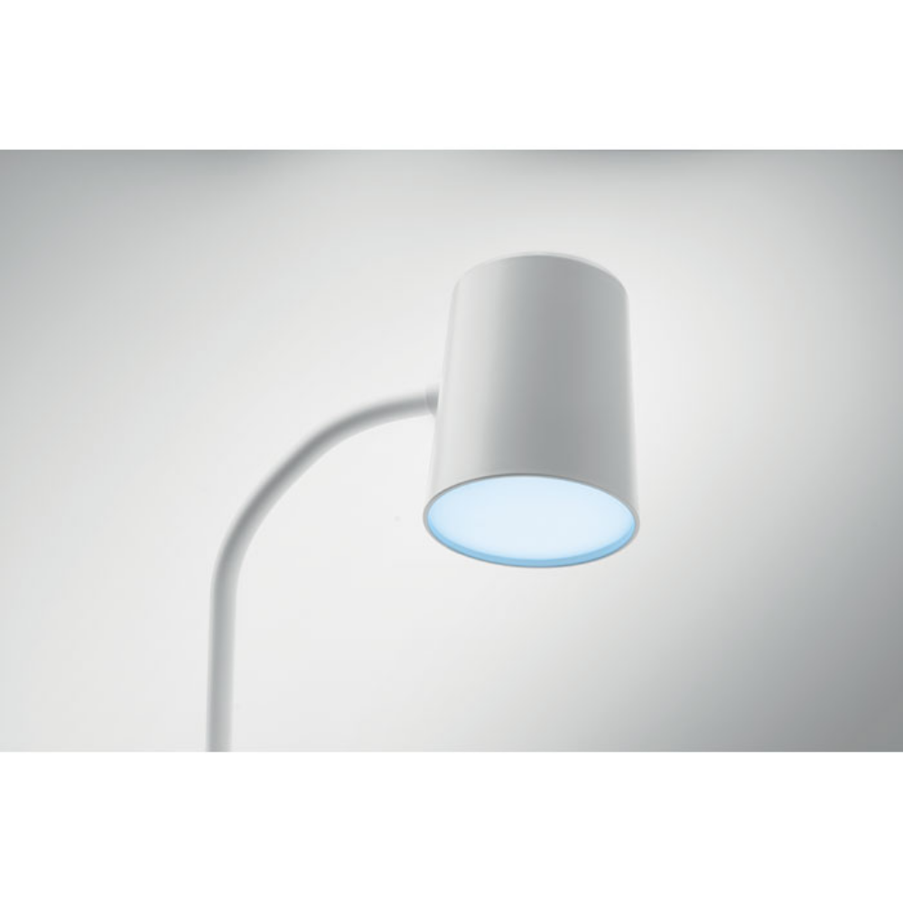 A wireless charging device that also functions as a lamp and speaker - Henley-in-Arden